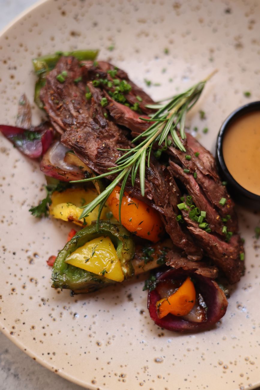 roasted lamb with vegetables sprinkled with chives